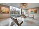 Sitting area in lobby features a chandelier, chairs, tables, and windows at 4000 N Meridian St # Apt 15J, Indianapolis, IN 46208