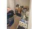 Cluttered bedroom filled with boxes and storage containers at 4006 Kenneth Ave, Indianapolis, IN 46226