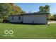 Gray siding of home with dark trim, large lawn at 4006 Kenneth Ave, Indianapolis, IN 46226