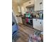 Kitchen with stainless steel appliances, white cabinets and gray countertops at 4006 Kenneth Ave, Indianapolis, IN 46226