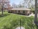A beautiful aerial view of a single-story brick home on a well-manicured lot in a quiet neighborhood at 4037 Hazy Ln, Greenwood, IN 46142