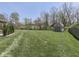 Expansive backyard featuring lush lawn space and a storage shed, great for outdoor activities at 4037 Hazy Ln, Greenwood, IN 46142