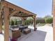 Relaxing backyard with a covered gazebo featuring comfortable seating and lush landscaping at 4037 Hazy Ln, Greenwood, IN 46142