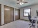 Neutral bedroom with large window, closets and carpet flooring provides space and natural light at 4037 Hazy Ln, Greenwood, IN 46142