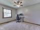 Comfortable carpeted bedroom featuring a ceiling fan and natural light from the window at 4037 Hazy Ln, Greenwood, IN 46142