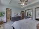 Carpeted primary bedroom featuring ensuite bathroom, closet, and a tray ceiling at 4037 Hazy Ln, Greenwood, IN 46142