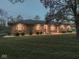 Inviting single-story brick home featuring a lush green lawn and professionally maintained landscaping at 4037 Hazy Ln, Greenwood, IN 46142