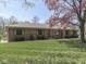 Charming single-story brick home with well-maintained lawn, landscaping, and an attached garage at 4037 Hazy Ln, Greenwood, IN 46142