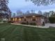 Charming single-story brick home with manicured lawn and landscape lighting for beautiful curb appeal at 4037 Hazy Ln, Greenwood, IN 46142