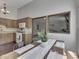 Kitchen boasts wood cabinets and modern appliances next to a dining area at 4037 Hazy Ln, Greenwood, IN 46142