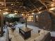 The covered pergola has outdoor seating, a ceiling fan and decorative string lighting for a relaxing atmosphere at 4037 Hazy Ln, Greenwood, IN 46142