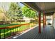 Large wooden deck overlooking a lush green backyard with mature trees and manicured lawn at 4651 Monterey Dr, Columbus, IN 47203