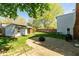 Serene backyard with a charming shed, paved patio, and lush green lawn at 4651 Monterey Dr, Columbus, IN 47203