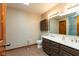 This bathroom has a double vanity, new floors and neutral paint at 4651 Monterey Dr, Columbus, IN 47203