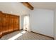 Bedroom featuring carpeted floors and a beamed ceiling at 4651 Monterey Dr, Columbus, IN 47203