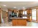 Well-lit kitchen featuring an island, stainless steel appliances, and wood cabinetry at 4651 Monterey Dr, Columbus, IN 47203