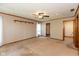 Spacious room features a ceiling fan, carpet, and neutral-tone walls at 4651 Monterey Dr, Columbus, IN 47203