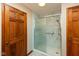 Walk-in shower features a glass door and white marble-look surround at 4651 Monterey Dr, Columbus, IN 47203