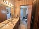 Charming bathroom with dual sinks, ample countertop space, and a view of the bathtub and toilet at 4726 Breckenridge Dr, Columbus, IN 47203