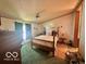 Cozy bedroom featuring a four-post bed, overhead fan, and a bright atmosphere at 4726 Breckenridge Dr, Columbus, IN 47203