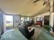 Comfortable living room with reclining leather sofas, a large rug, and natural light from the windows at 4726 Breckenridge Dr, Columbus, IN 47203