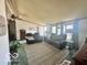 Inviting living room features reclining leather sofas, a patterned rug, and ample natural light from the windows at 4726 Breckenridge Dr, Columbus, IN 47203