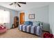 Bright bedroom with a daybed, neutral walls, and ample space for personalization at 500 Meadowlark Ct, Whiteland, IN 46184