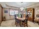 Traditional dining room with a chandelier, wooden furniture, and a decorative china cabinet at 500 Meadowlark Ct, Whiteland, IN 46184