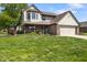 Charming two-story home featuring a covered porch, brick accents, and a well-manicured front yard at 500 Meadowlark Ct, Whiteland, IN 46184