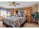 Serene bedroom with built in storage, a ceiling fan, and a comfortable, stylish bed at 500 Meadowlark Ct, Whiteland, IN 46184