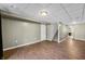 A spacious finished basement with wood-look flooring and ample room for entertaining at 5079 S Lick Creek Rd, Morgantown, IN 46160