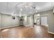 Finished basement with wood-look flooring, a workout area, and a laundry area at 5079 S Lick Creek Rd, Morgantown, IN 46160