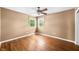 Comfortable bedroom with hardwood floors, ceiling fan and two windows at 5079 S Lick Creek Rd, Morgantown, IN 46160