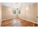 Bright bedroom with hardwood floors, neutral walls, and ample natural light at 5079 S Lick Creek Rd, Morgantown, IN 46160