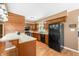 Functional kitchen featuring warm wood cabinets and a breakfast bar at 5079 S Lick Creek Rd, Morgantown, IN 46160