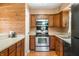 Well-equipped kitchen boasting stainless steel appliances and wooden cabinetry at 5079 S Lick Creek Rd, Morgantown, IN 46160