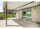 Covered patio with stone walls and view of the backyard at 5079 S Lick Creek Rd, Morgantown, IN 46160