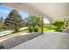 Covered porch with concrete flooring and a view of the landscaped front yard at 5079 S Lick Creek Rd, Morgantown, IN 46160