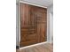 Basement featuring large storage space with sliding dark wood doors at 5252 N College Ave, Indianapolis, IN 46220