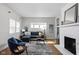 Bright living room with a fireplace and comfortable seating at 5252 N College Ave, Indianapolis, IN 46220