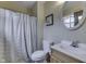 Traditional bathroom with decorative mirror over the sink and a white shower curtain at 5335 Honey Comb Ln, Indianapolis, IN 46221