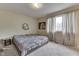 Comfortable bedroom with a window, carpet, and neutral walls, creating a relaxing atmosphere at 5335 Honey Comb Ln, Indianapolis, IN 46221