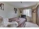 Bedroom with basketball decor, a large window letting in plenty of natural light, and soft carpet at 5335 Honey Comb Ln, Indianapolis, IN 46221