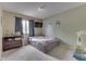 A comfortable bedroom featuring a window with curtains and a cozy atmosphere at 5335 Honey Comb Ln, Indianapolis, IN 46221