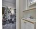 View into an exercise room with an elliptical machine, carpeted floors, and decorated with a Christmas tree at 5335 Honey Comb Ln, Indianapolis, IN 46221