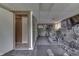 Spacious finished basement gym featuring neutral colors and open doorway at 5335 Honey Comb Ln, Indianapolis, IN 46221