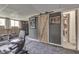 Finished basement gym with exercise machines and wooden barn door at 5335 Honey Comb Ln, Indianapolis, IN 46221