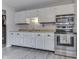 Functional kitchen with white cabinets, stainless steel appliances, and ample counter space at 5335 Honey Comb Ln, Indianapolis, IN 46221