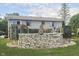 A backyard view of above ground pool featuring rock decor and privacy features at 5335 Honey Comb Ln, Indianapolis, IN 46221