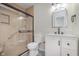 An updated bathroom with a glass enclosed shower and white vanity at 5622 Imperial Woods Cir, Indianapolis, IN 46224